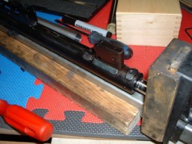 Barrel and receiver in a spring compressor