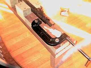 Original spring guide removed from the rifle