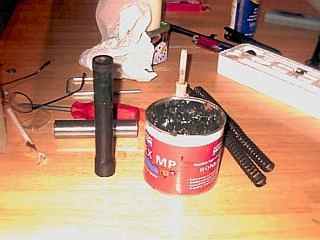 Piston and spring with a light coat of moly paste