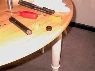 Piston with leather seal next to the unused synthetic seal