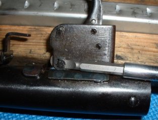 Pushing out the large trigger pin after removing the retaining clip
