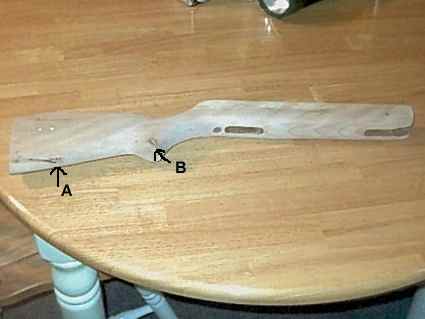 Right side of stock with two fill spots at a wood knot