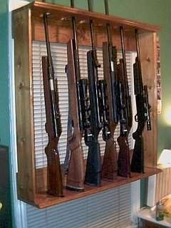 Air rifle rack top oval cutout for the barrel