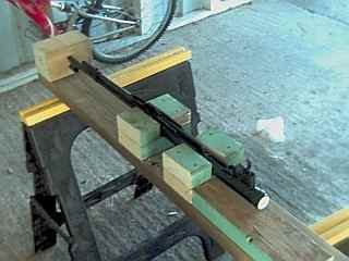 Support blocks screwed on both sides of the barrel